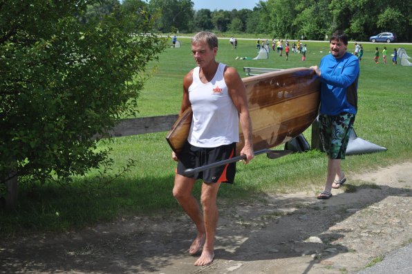 Carrying a paddleboard as beautiful and sturdy as Walton’s is a two-man job.