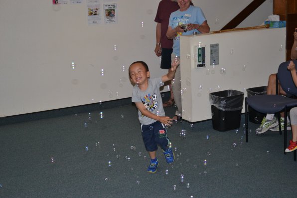 Emy Hao single-handedly tries to pop every bubble in the room. (FYI, he was not successful.)