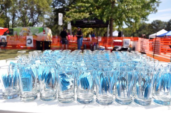 Those cups are full of tickets, tickets to the craft brew festival where you can fill the cups with tasty, beery goodness. So in the interest of optimism we’d say all of those cups are half full.