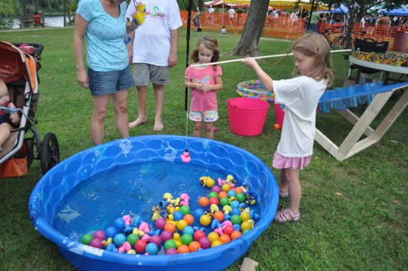 Amelia Crumrine, 6, fishes for some toys while Zoe Crumrine, 4, looks on.