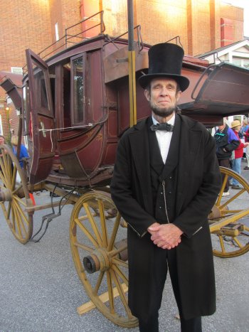 Appearing on behalf of Red River Theatres’ “History Alive” educational programming, Lincoln impersonator Steve Wood of Claremont stands with a Concord Coach from the Abbot Downing Historical Society outside at the arts fair preceding the Gala. Wood spoke from stage as Lincoln remembering his visit to Concord in 1860.