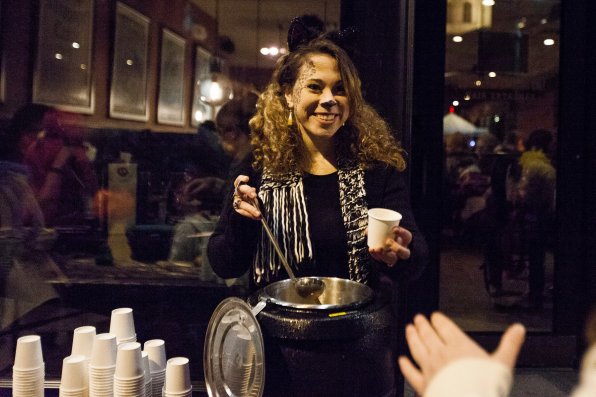 Brianna Rossiter of the Barley House gives out hot apple cider instead of candy.