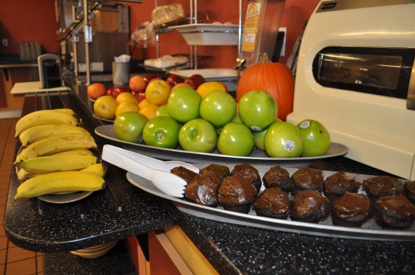 All of our favorite fruits in the dining hall: bananas, apples, oranges and chocolate cupcakes.