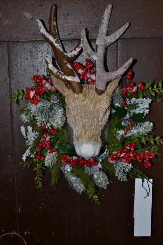 Who would have thought a fake reindeer would make the perfect wreath centerpiece?