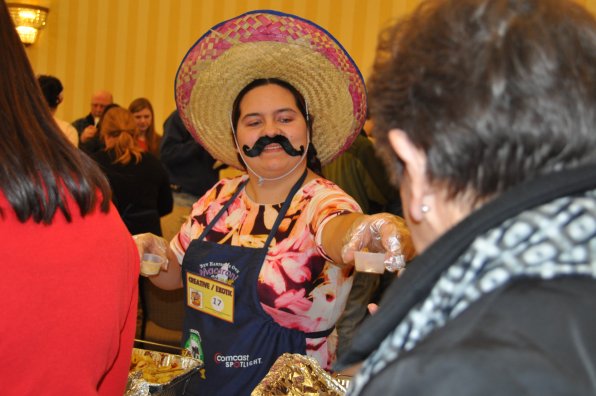 Defending grand champion Alyssa Muise has a sweet ’stache and serves up some fajita mac and cheese.