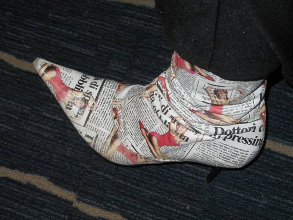 Who says newspapers are dead? This fan’s footwear clearly says otherwise.