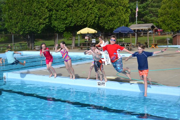 There are many great things about being a member of the Cooperative Pool Club of Concord, Copoco for short, and synchronized deep end jumping is definitely one of them. Just look at all those happy faces about to get a nose full of water.