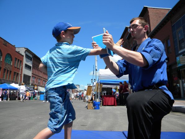 Hiya! Michael Roche tests his hand at a little karate at Steve DeMasco’s Shaolin Studios tent. Is he doing karate while eating a lollipop? Mad props.