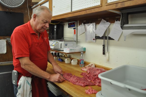 Tony Heath doing what he does best, cutting a big ole’ slab of meat into smaller, more manageable slabs of meat.
