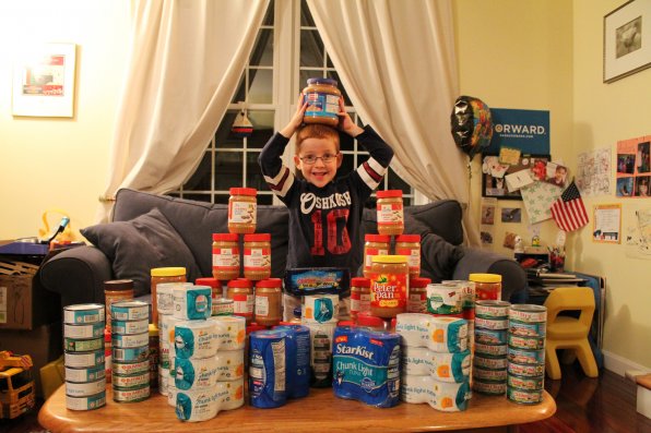 Six-year-old friend of the Insider, Aidan Lamothe – who, as you can see, is ridiculously photogenic – continued his annual birthday tradition of collecting food for the Capital Region Food Program. That’s quite a haul!