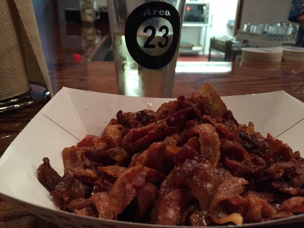 Our intrepid intern Curtis Fraser conquered this pile of bacon at Area 23, ensuring high marks for the summer.