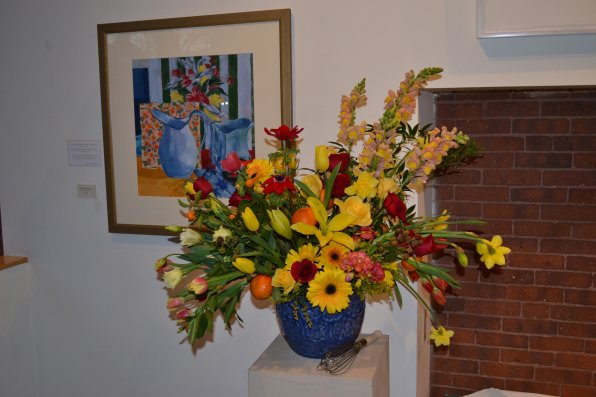 Blue Pitcher and Whisk, Catherine Bartlett Hirani. Floral arrangement by Judith Maloy and Martha Massey.