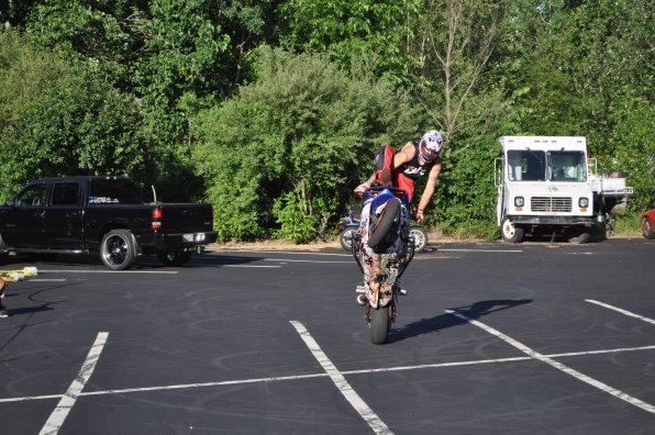 Saporetti climbs to the top of the bike for a better view.