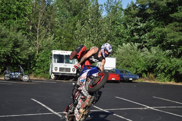 Is Joey “Crazy White Boy” Saporetti kicking in the windshield on that ice cream truck? Nope, that’s just an optical illusion. He’s actually performing a crazy freestyle trick as part of a motorcycle week showcase at Makris Lobster House.