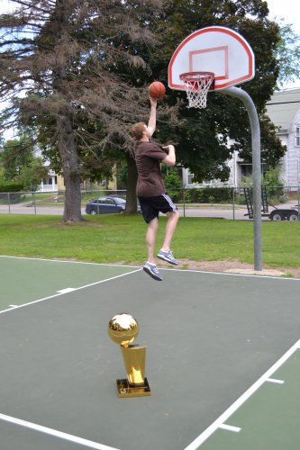 Artistic trophy shot with Matt nailing a left-handed layup at West Street Park.