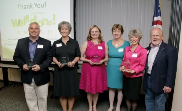 Here we see last year’s Well Done! Award winners along with Capital Area Wellness Coalition steering committee members Johane Telgener and Joe Kasper. Clearly Joe didn’t get the memo that he was supposed to coordinate his jacket color with Johane’s dress so everyone would be able to pair off in matching color schemes.