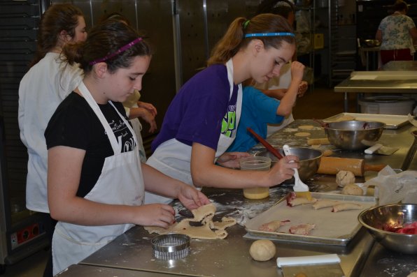 Keelin Cripps and Laura Gamelin put the finishing touches on their mixed berry tarts.