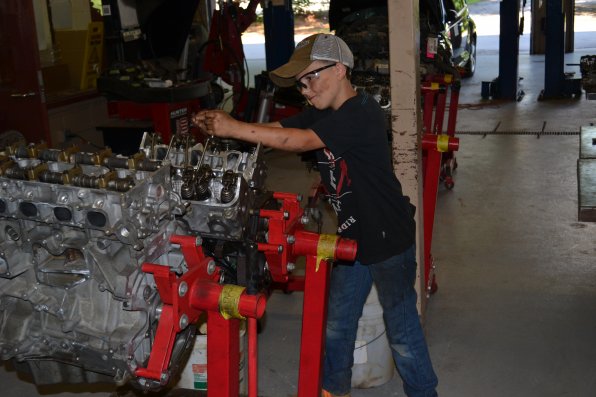 Nick Sedgley doesn’t mind getting a little dirty while working on an engine.