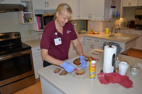 Lisa Mallet, the first cook in the history of the Hospice House, wraps up some tasty looking bread.
