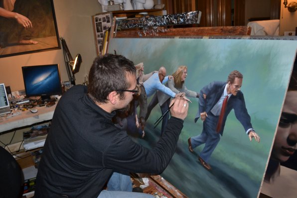 Pothier does subtle touch ups on a recent painting, titled, ‘The Mechanics of the Pack.’