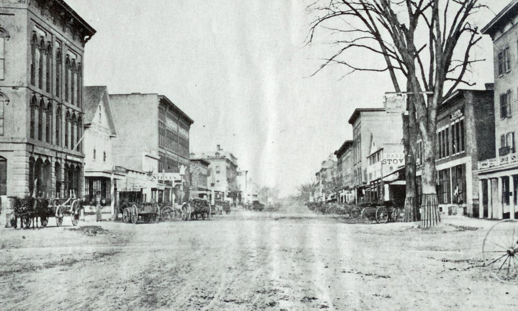 This was our proposal for the Main Street redesign, but for some reason the powers that be weren’t into dirt roads and buggies, even when we conceded on the issue of buggy parking meters. We were just trying to kick it old school. We thought retro was in! Anyway, this photo from reader Earl Burroughs looking north on Main Street from a long, long time ago will have to do instead.
