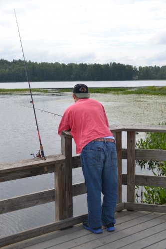 Sean Mckenzie looks for a bite while dropping a line off the Turtletown Pond pier.