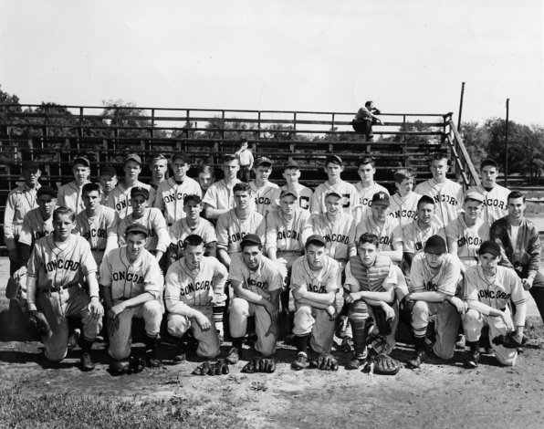 This picture of the 1947 Concord High School baseball team features two sweet photobombs: the dude in the top right of the bleachers and the kid who may be picking his nose, dead center (if you happen to know those two, we’ll take their names, too!) <strong>Front row:</strong> George Ford, Herbie Berquist, Butch Ahern, Poggie Mills, Guy Strachan, Bill Erickson, Paul Eastman, Bud Coughlin. <strong>Second row:</strong> Lefty Callahan, Tom Duffet, Rae Comolli, Toots Audet, Dick Russell, Paul Phillips, Conky O’Connell, Hap Simpson, Dave Audet, Acie Slattery, asst. coach Olin Ingham. <strong>Third row:</strong> Coach Delly Callahan, UNKNOWN No. 1, UNKNOWN No. 2, Jack Erickson, UNKNOWN No. 3, Skip Milliken, UNKNOWN No. 4, Bob Bennett, Bob Lockwood, Bill Eastman, George Calkins, UNKNOWN No. 5, Don Heath, Ted Rice, Dave Landry. Can we just stop to celebrate the fact that this squad featured guys nicknamed Poggie, Lefty, Toots, Conky, Hap and Skip? 