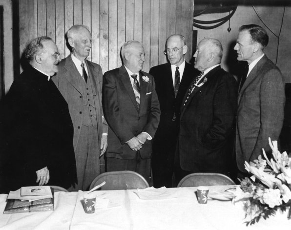 This is the William P. “Bill” Slattery Testimonial Banquet from April 21, 1956. <strong>Left to right:</strong> Rev. Monsignor J. S. Buckley, Headmaster Charles F. Cook, Bill Slattery, UNKNOWN, John Reardon and Red Rolfe (who played for the Yankees.)