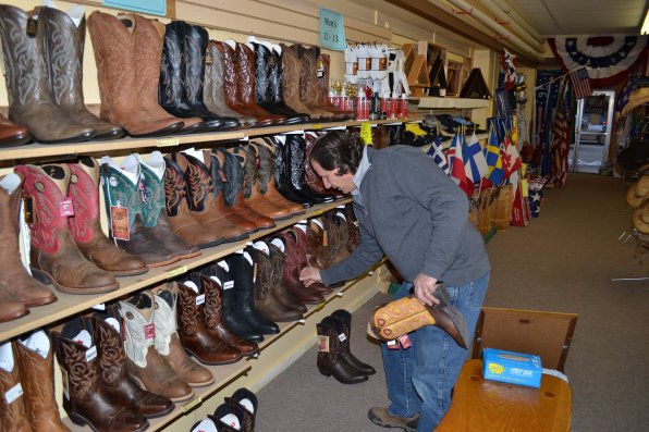 Patrick Page, owner of American Cowboy Supply located in Flag Works on North Main Street, has hundreds of boots for all you wannabe cowboys to choose from. So it’s no surprise that Page spends his days arranging them based on style, color and of course, size.