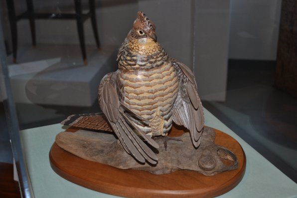 Wood carving of a Drumming Ruffed Grouse, Robert and Virginia Warfield.
