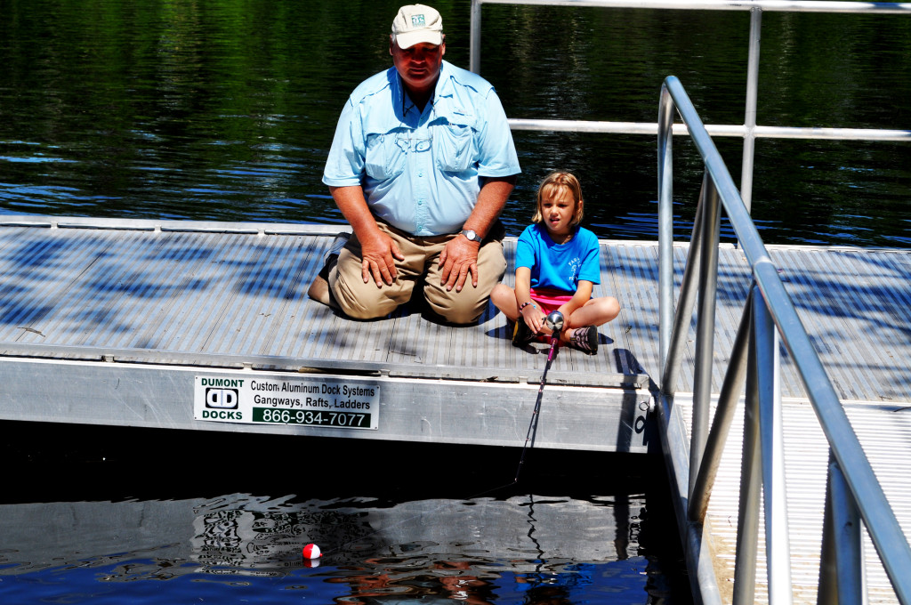 Erin Martel, 6, fishes under the watchful eye of wildlife biologist Eric Orff Thursday morning. The Sierra Club is raising awareness of mercury levels in light of an upcoming Senate vote that could erase recently established regulations on the matter. “One in four fish in the Merrimack will have such high mercury, it can put my 6-year-old granddaughter at risk,” Orff said. “What better time than now to clean up the environment?”