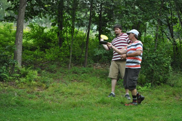 Marty Vaughn, owner of Top O’ The Hill, gives Tim some instructions on a proper flick shot. So did the instructions take? Well, if not injuring oneself or any nearby wildlife counts as a yes, then yes!
