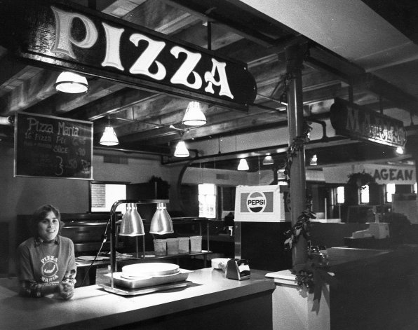Sue Johnson awaits her next customer at Pizza Maria, one of the eateries that popped up in what would be dubbed “food row” in the square.