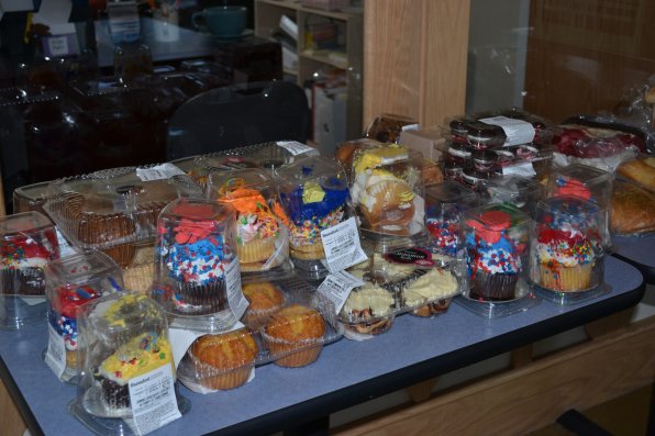 Donated baked goods line a table for people to choose.