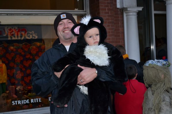 Tim LeClair, owner of Amish Country Barn, ventured out to the Halloween Howl on Friday night with his 1-year-old son, Gage, whose skunk costume earned him the nickname Stinky from dad.