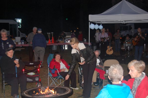 Sue Pollock, director of programs at Havenwood Heritage Heights, roasts up a marshmallow.