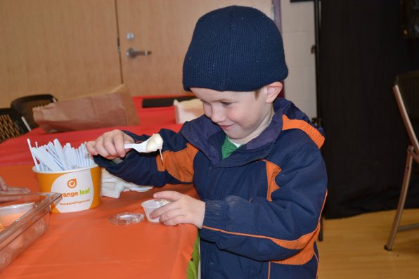 This little dude, also known as 4-year-old Koen Clark, enjoys some frozen yogurt from Orange Leaf.