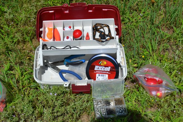 A tackle box filled with stuff like lures, bobbers, weights and other necessary tools are a good first step to a successful fishing trip.