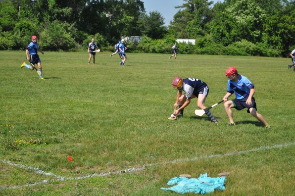 The Barley House Wolves had their hurling home opener at Amoskeag Beverages in Bow on Saturday afternoon, and hurl they did! They defeated a visiting team from Hartford, and if we understood how the scoring went in hurling, we’d totally put the final score here. It was a perfect day for some good action, though, and there was plenty of opening-day pageantry – the teams walked onto the field to the sound of bagpipes and the first ball was thrown out by Mayor Jim Bouley.