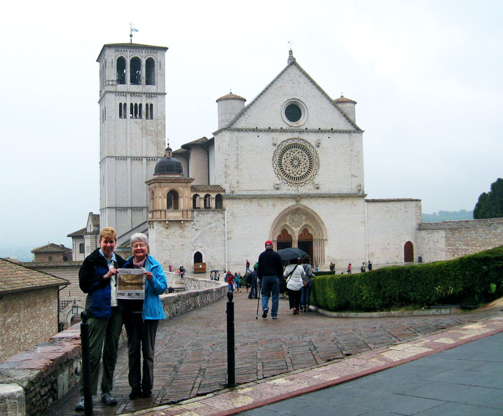 Faith Goodwin and Joyce Benson recently took a trip to Italy – and they brought the Insider with them! Here they are in front of the Basilica of Saint Francis in Assisi.