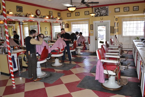 Barbers Josh Craggy, Ian Bergeron and James Carroll do their hair cutting thing.