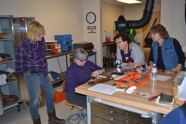Barbara McLaughlin gives a demo during her Into to Metal Jewelry class and it’s obviously a good one since she has the full attention of students Darlene Doughty, Terry Handel and Patricia Anne Stone.