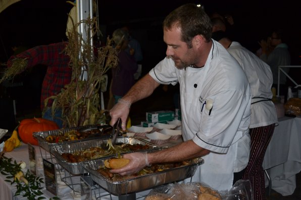 Scott Jones, executive chef at the co-op, makes a brat wurst sub with peppers and onions. More brats were consumed on Thursday night than any single night in the history of Concord.