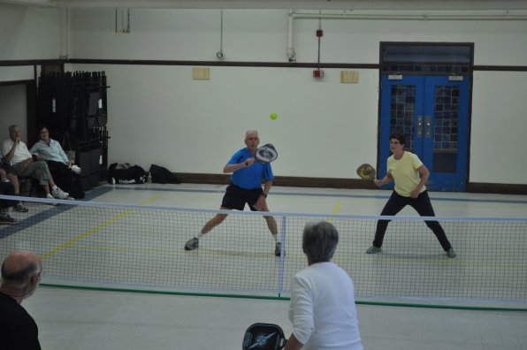 Larry Phillips and Sue Withers lean in to return a hit from Goldie Anderson during pickleball action at the senior center last week. Competition is fast and furious, which is also the name of a bad movie.