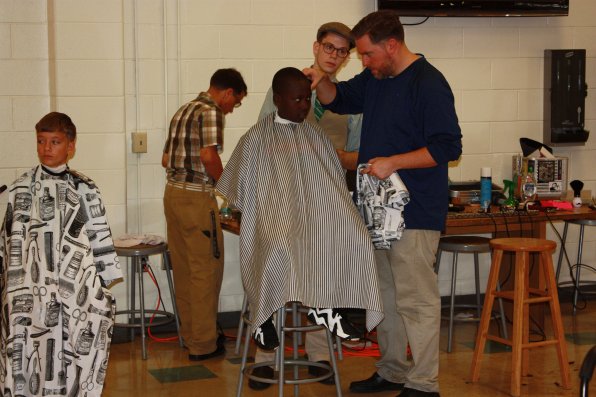 Daniel Spooner (left) and Odeyi Kizumg, both 11, get some work done on their hair.