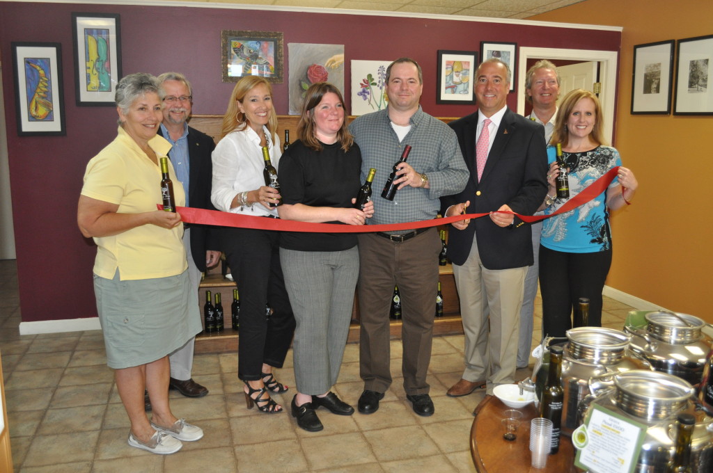 Celeste Oliva, a shop specializing in a huge variety of olive oils and balsamic vinegars at 75 S. Main St., celebrated its grand opening Thursday with the mayor, several customers and Chamber of Commerce representatives. Starr Manus, Tim Sink, Donna Rice, owners Charla and Clark Mayotte, Mayor Jim Bouley, Paul Ebbs and Heather Capraro were on hand to snip the ribbon. Someone suggested framing a piece of the ribbon, but we think we’d rather just dip it in one of those amazing olive oils. Stop down to sample the tastes (wild mushroom and sage infused olive oil? Um, yes please!) and grab a bottle or two.