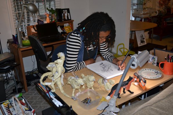 Amaranthia Gittens-Jones works on a drawing of Amaterasu, the Goddess of the Sun, from the Japanese video game, Okami.