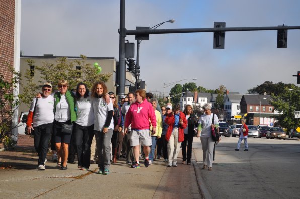 Members of the Wellness Coalition lead the marchers down Main Street. An unofficial count came to 105 walkers.
