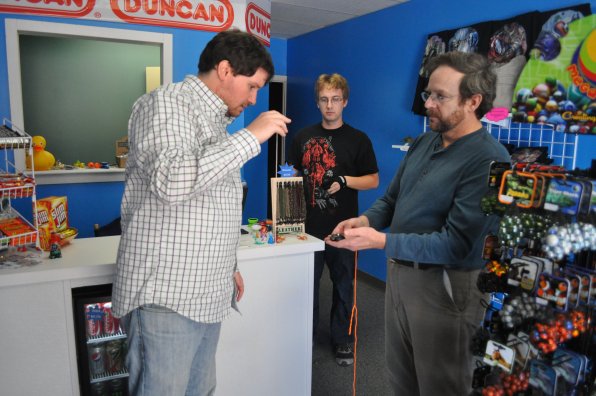 Andy McBride shares the finer points of the yo-yo with Tim while Dan McBride looks on – and ponders his next crazy trick.