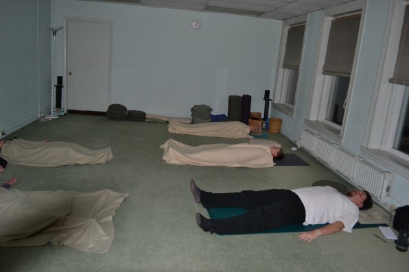 We see dead people! Oh, those are just yoga aficianados. But why didn’t Tim get a blanket?